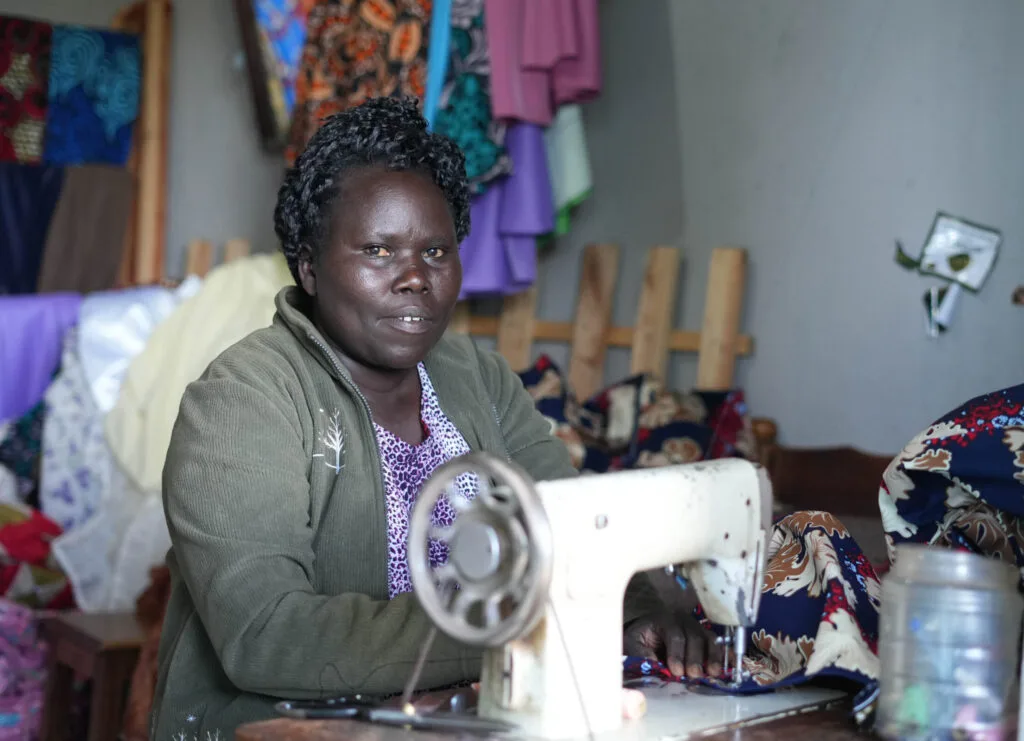 Phillis Kerubu at her tailoring business in Kisii, Kenya which she opened thanks to Kahawa 1893. Photo by Billy Miaron Phillis Kerubu at her tailoring business in Kisii, Kenya which she opened thanks to Kahawa 1893. Photo by Billy Miaron