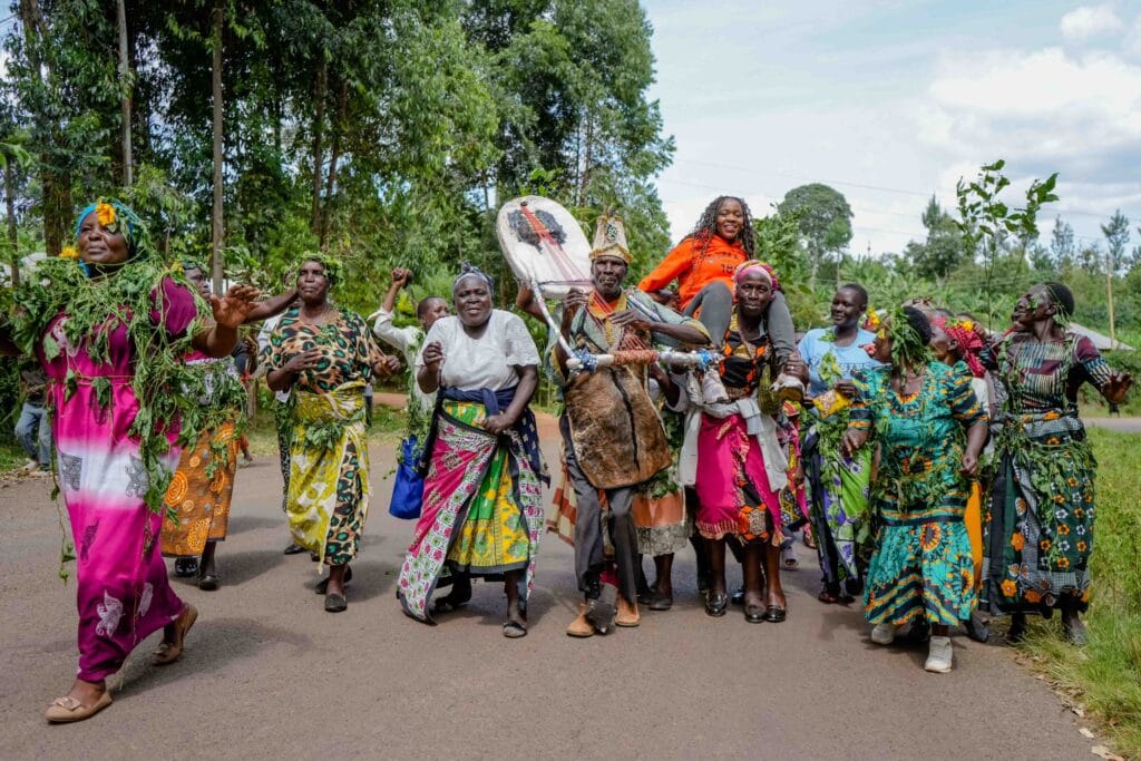 Welcome Party. Margaret Nyamumbo, founder of Kahawa 1893 is welcomed in celebrations by women in her community in Kisii, Kenya. Photo by Billy Miaron